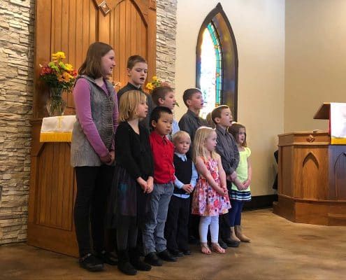 Children singing during a worship service at St. Peter’s Evangelical Lutheran Church